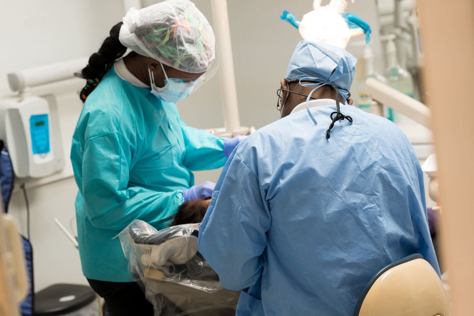 Dentist treating a patient at 24/7 Urgent Dental Care in Atlantis, Florida