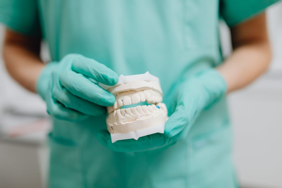 Custom full and partial dentures being fitted and checked at the dental office