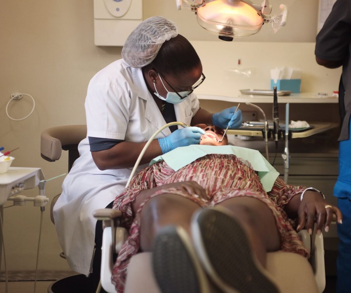 Dentist gently performing root canal therapy on a relaxed patient